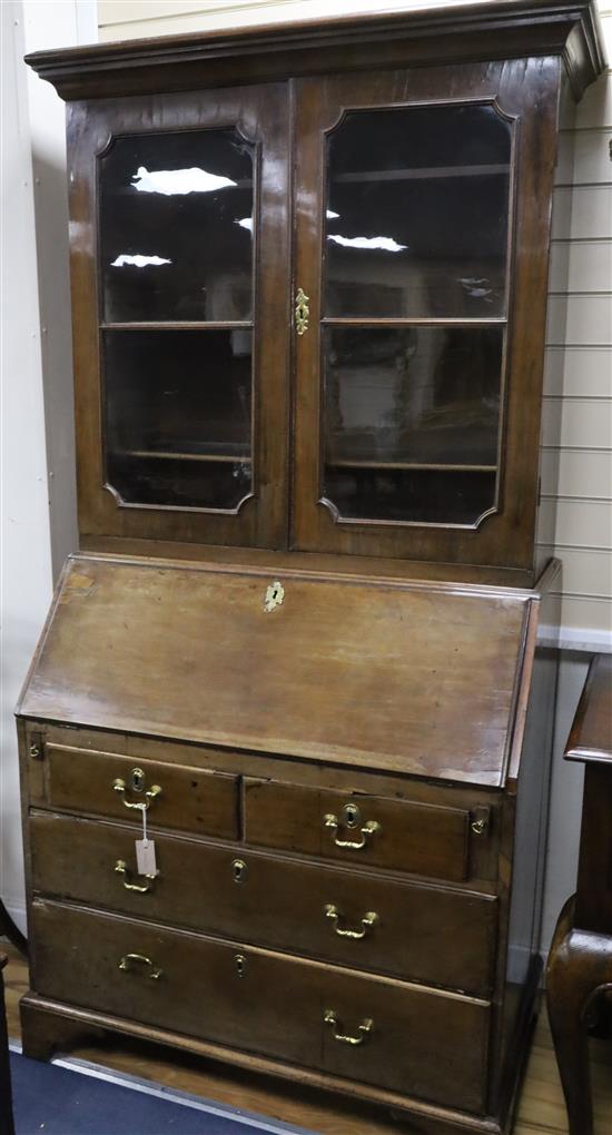 A George III oak and walnut bureau bookcase W.96cm